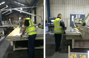 workers cutting and adjusting the sheets of metal for cnc machine
